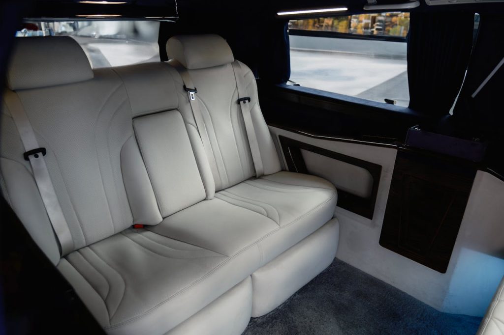 Explore the spacious and luxurious interior of a Mercedes-Benz V-Class, featuring premium white leather seats.